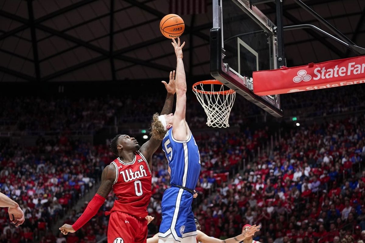 Jan 10, 2026; Salt Lake City, Utah, USA;  BYU Cougars guard Richie Saunders (15) makes a driving layup during the first half against the Utah Utes at Jon M. Huntsman Center. Mandatory Credit: Aaron Baker-Imagn Images