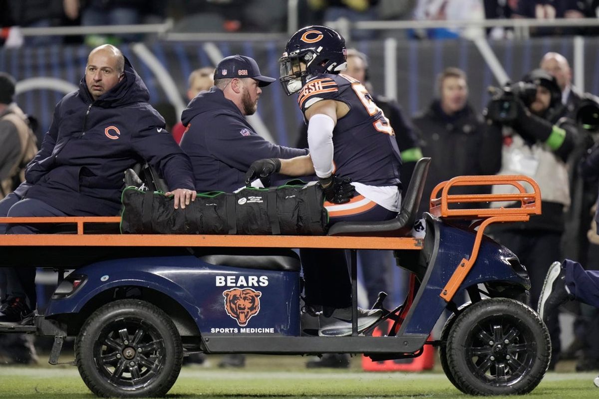 Chicago Bears linebacker T.J. Edwards (53) is carted off the field after being injured during the second quarter of their wild card playoff game against the Green Bay Packers Saturday, January 10, 2026 at Soldier Field in Chicago, Illinois.