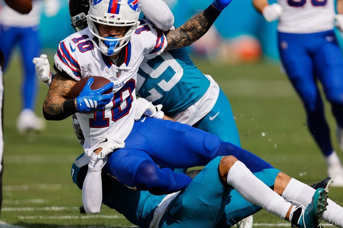 Jacksonville Jaguars cornerback Greg Newsome II (6) brings down Buffalo Bills wide receiver Khalil Shakir (10) during the first quarter in an NFL football AFC Wild Card playoff matchup, Sunday, Jan. 11, 2026, in Jacksonville, Fla. Bills lead 10-7 at the half over the Jaguars. [Doug Engle/Florida Times-Union]