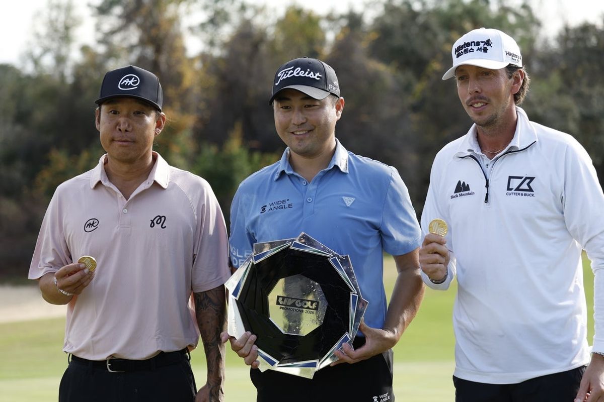 Jan 11, 2026; Lecanto, Florida, United States; Anthony Kim, left, Richard T. Lee and Bjorn Hellgren celebrate after taking the top three spots in the LIV Golf Black Diamond Ranch Promotions golf tournament at Black Diamond Ranch. Mandatory Credit: Jeff Swinger-Imagn Images