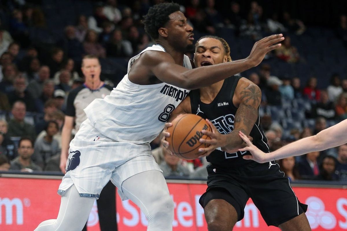 Jan 11, 2026; Memphis, Tennessee, USA; Brooklyn Nets forward Noah Clowney (21) drives to the basket as Memphis Grizzlies forward/center Jaren Jackson Jr. (8) defends during the first quarter at FedExForum. Mandatory Credit: Petre Thomas-Imagn Images