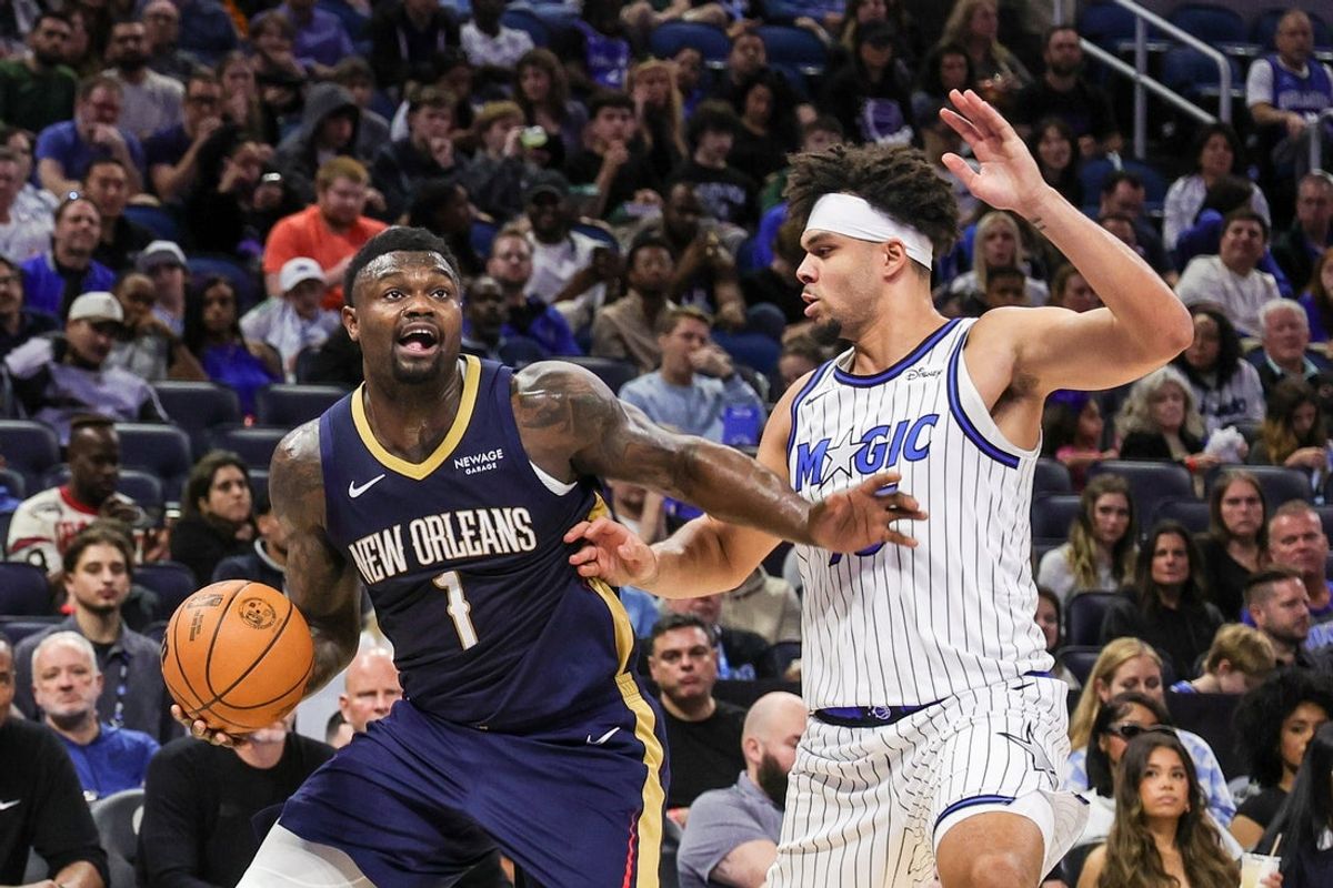 Jan 11, 2026; Orlando, Florida, USA; New Orleans Pelicans forward Zion Williamson (1) drives to the basket against Orlando Magic forward Noah Penda (93) during the second quarter at Kia Center. Mandatory Credit: Mike Watters-Imagn Images