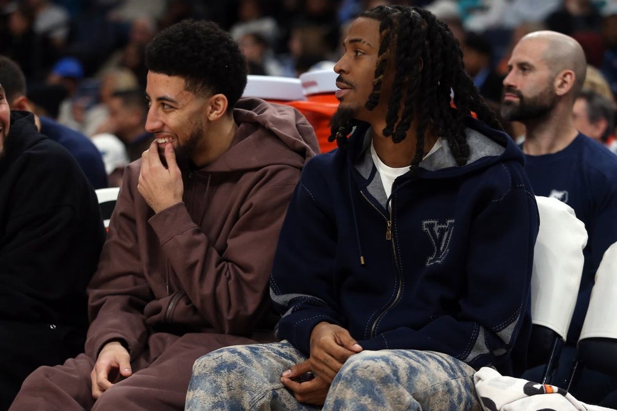 Jan 11, 2026; Memphis, Tennessee, USA; Memphis Grizzlies guard Scotty Pippen Jr. (left) and guard Ja Morant (right) looks on during the second quarter against the Brooklyn Nets at FedExForum. Mandatory Credit: Petre Thomas-Imagn Images