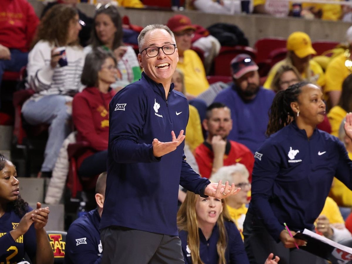 Jan 11, 2026; Ames, Iowa, USA; West Virginia Mountaineers head coach Mark Kellogg watches his team play the Iowa State Cyclones during the first half at James H. Hilton Coliseum. Mandatory Credit: Reese Strickland-Imagn Images