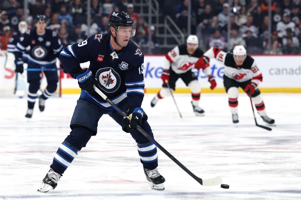 Jan 11, 2026; Winnipeg, Manitoba, CAN; Winnipeg Jets center Jonathan Toews (19) skates through the neutral zone during a game against the New Jersey Devils in the second period at Canada Life Centre. Mandatory Credit: James Carey Lauder-Imagn Images