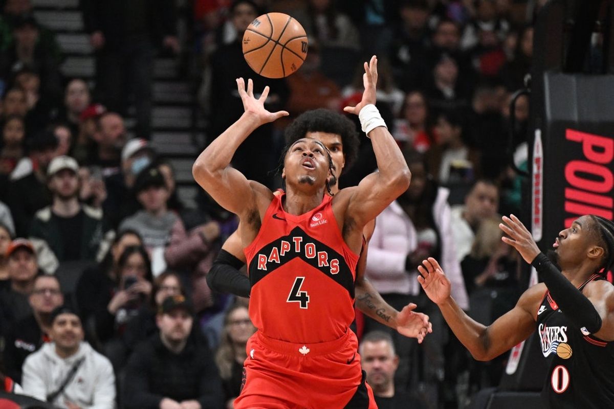 Jan 11, 2026; Toronto, Ontario, CAN; Toronto Raptors forward Scottie Barnes (4) reaches for the ball against the Philadelphia 76ers in the first half at Scotiabank Arena. Mandatory Credit: Dan Hamilton-Imagn Images