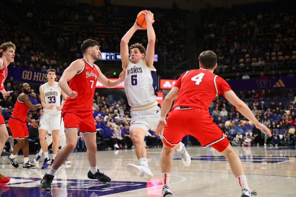 Jan 11, 2026; Seattle, Washington, USA; Washington Huskies forward Hannes Steinbach (6) drives towards the basket while guarded by Ohio State Buckeyes center Ivan Njegovan (7) during the first half at Alaska Airlines Arena at Hec Edmundson Pavilion. Mandatory Credit: Steven Bisig-Imagn Images