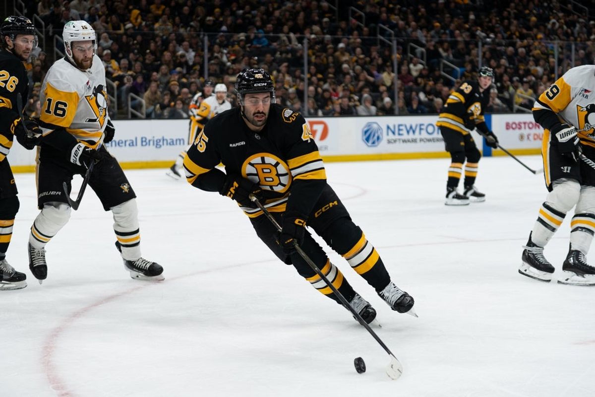 Jan 11, 2026; Boston, Massachusetts, USA; Boston Bruins defenseman Jonathan Aspirot (45) skates with the puck during the second period of the game against the Pittsburgh Penguins at TD Garden. Mandatory Credit: Natalie Reid-Imagn Images
