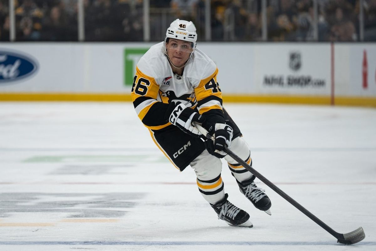 Jan 11, 2026; Boston, Massachusetts, USA; Pittsburgh Penguins center Blake Lizotte (46) skates with the puck during the second period of the game against the Boston Bruins at TD Garden. Mandatory Credit: Natalie Reid-Imagn Images