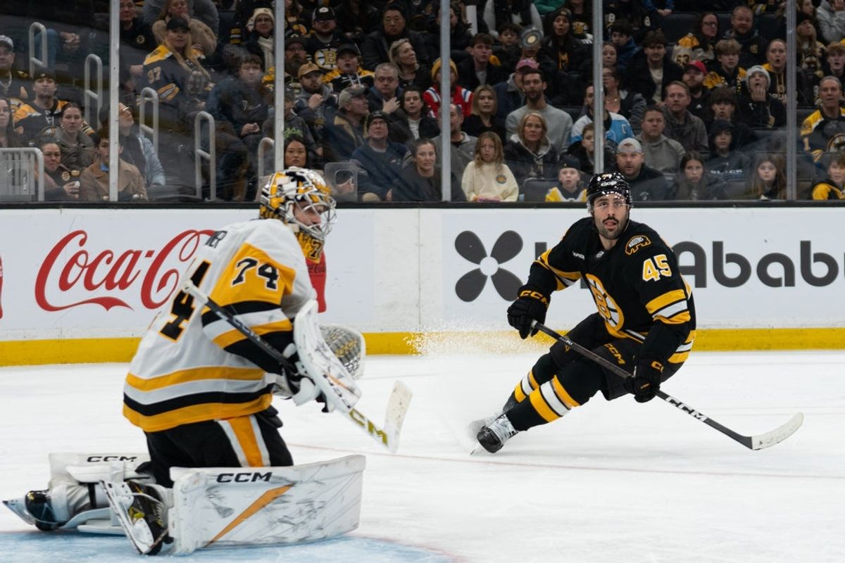 Jan 11, 2026; Boston, Massachusetts, USA; Boston Bruins defenseman Jonathan Aspirot (45) watches the puck in the air during the third period of the game against the Pittsburgh Penguins at TD Garden. Mandatory Credit: Natalie Reid-Imagn Images