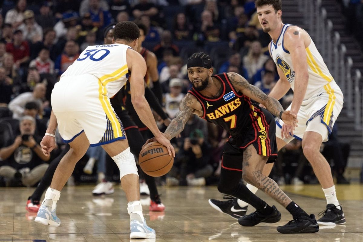 Jan 11, 2026; San Francisco, California, USA; Atlanta Hawks guard Nickeil Alexander-Walker (7) slaps the ball away from Golden State Warriors guard Stephen Curry (30) during the first quarter at Chase Center. Mandatory Credit: D. Ross Cameron-Imagn Images