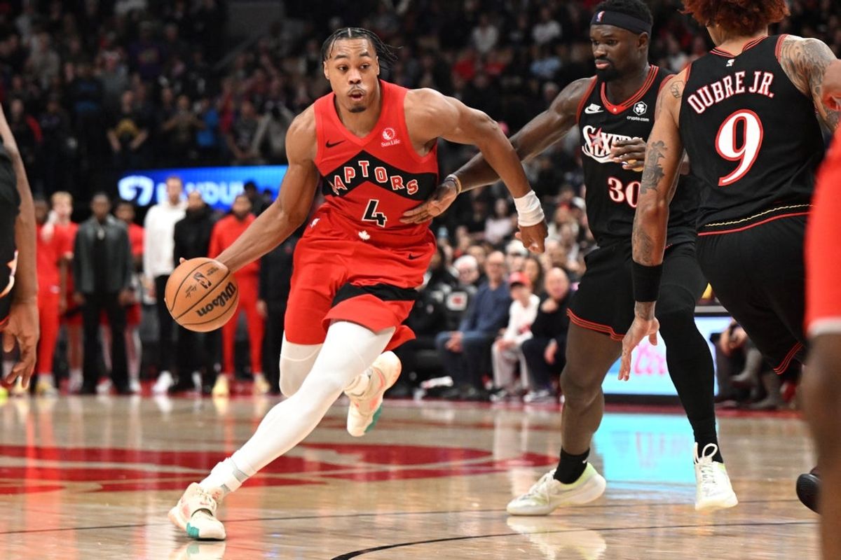Jan 11, 2026; Toronto, Ontario, CAN;  Toronto Raptors forward Scottie Barnes (4) dribbles the ball past Philadelphis 76ers center Adam Bona (30) in the second half at Scotiabank Arena. Mandatory Credit: Dan Hamilton-Imagn Images