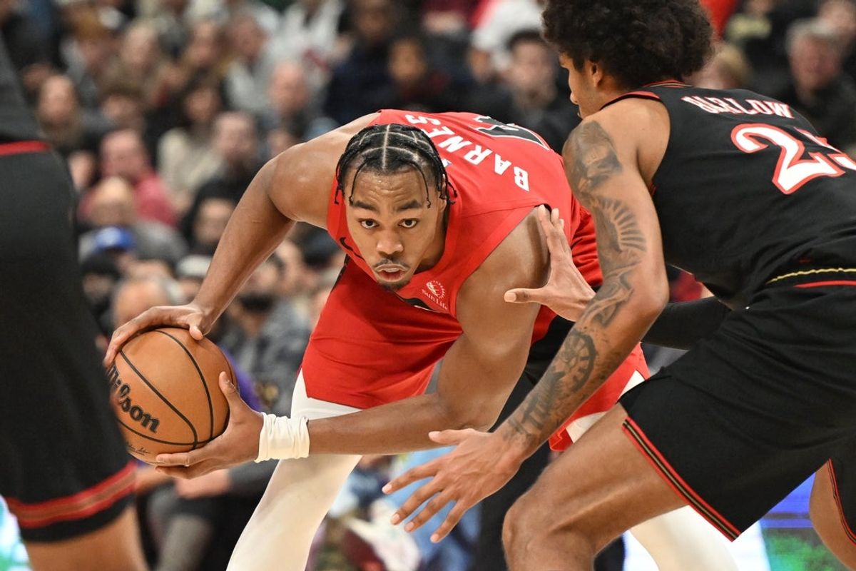 Jan 11, 2026; Toronto, Ontario, CAN;  Toronto Raptors forward Scottie Barnes (4) looks for a way past Philadelphia 76ers forward Dominick Barlow (25) in the second half at Scotiabank Arena. Mandatory Credit: Dan Hamilton-Imagn Images