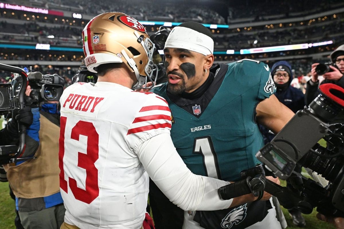 Jan 11, 2026; Philadelphia, PA, USA; San Francisco 49ers quarterback Brock Purdy (13) and Philadelphia Eagles quarterback Jalen Hurts (1) meet on the field in an NFC Wild Card Round game at Lincoln Financial Field. Mandatory Credit: Eric Hartline-Imagn Images