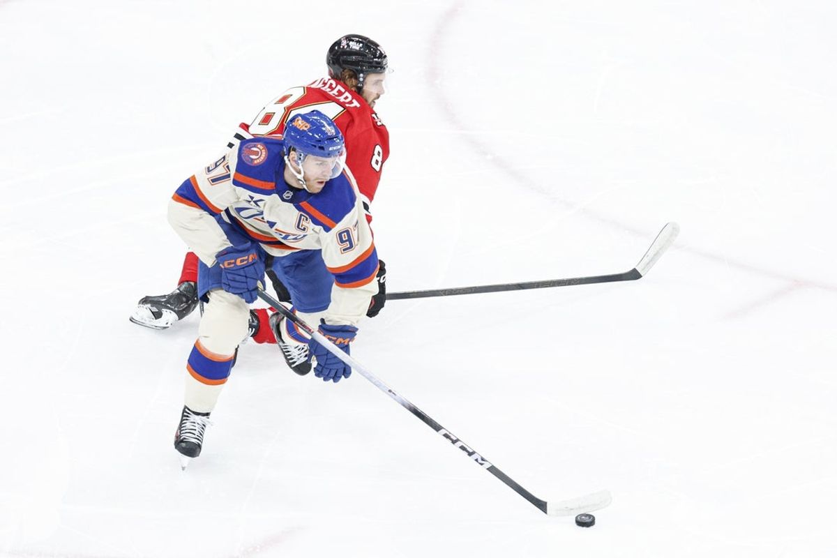Jan 12, 2026; Chicago, Illinois, USA; Edmonton Oilers center Connor McDavid (97) controls the puck against the Chicago Blackhawks during the first period at United Center. Mandatory Credit: Kamil Krzaczynski-Imagn Images
