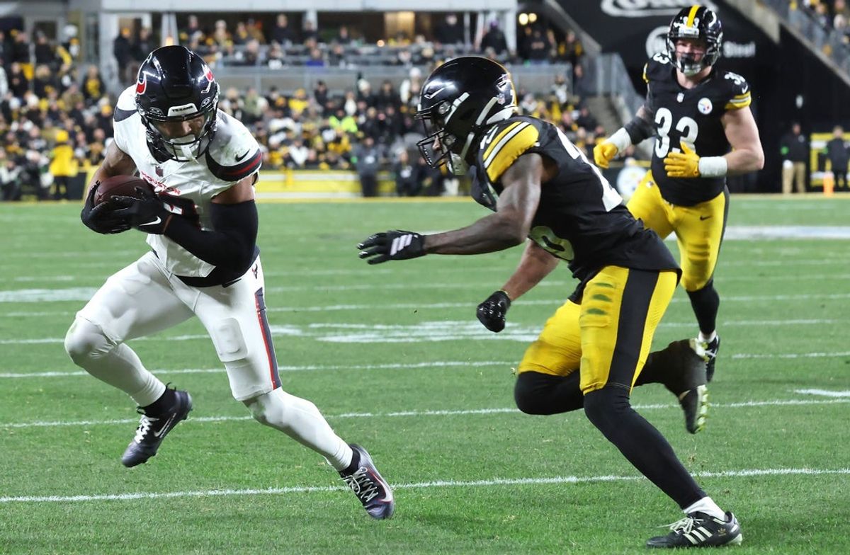 Jan 12, 2026; Pittsburgh, PA, USA; Houston Texans wide receiver Christian Kirk (13) catches a touchdown against Pittsburgh Steelers cornerback Brandin Echols (26) during the first half of an AFC Wild Card Round game at Acrisure Stadium. Mandatory Credit: Charles LeClaire-Imagn Images