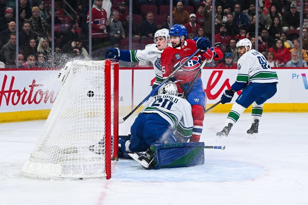 Jan 12, 2026; Montreal, Quebec, CAN; Montreal Canadiens defenseman Alexandre Carrier (45) scores a goal against Vancouver Canucks goalie Nikita Tolopilo (60) during the second period at Bell Centre. Mandatory Credit: David Kirouac-Imagn Images
