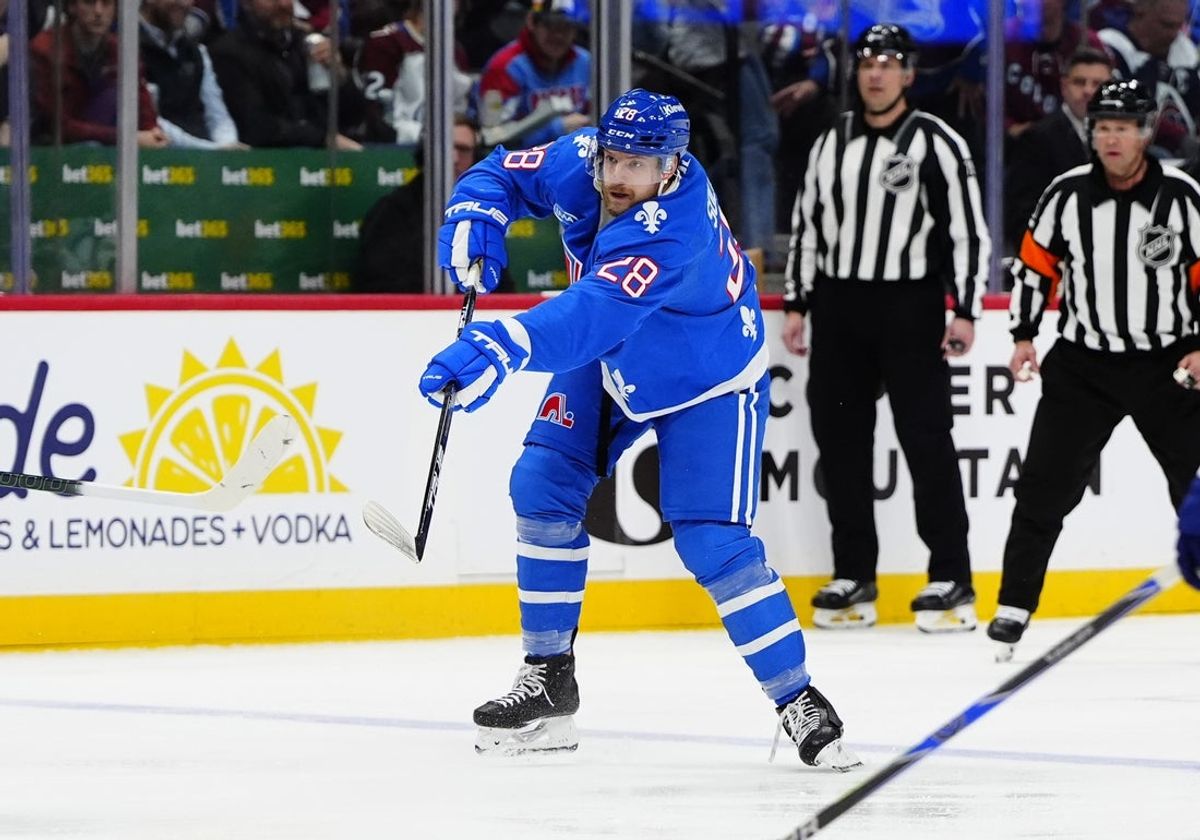 Jan 12, 2026; Denver, Colorado, USA; Colorado Avalanche defenseman Ilya Solovyov (28) shoots the puck in the second period against the Toronto Maple Leafs at Ball Arena. Mandatory Credit: Ron Chenoy-Imagn Images