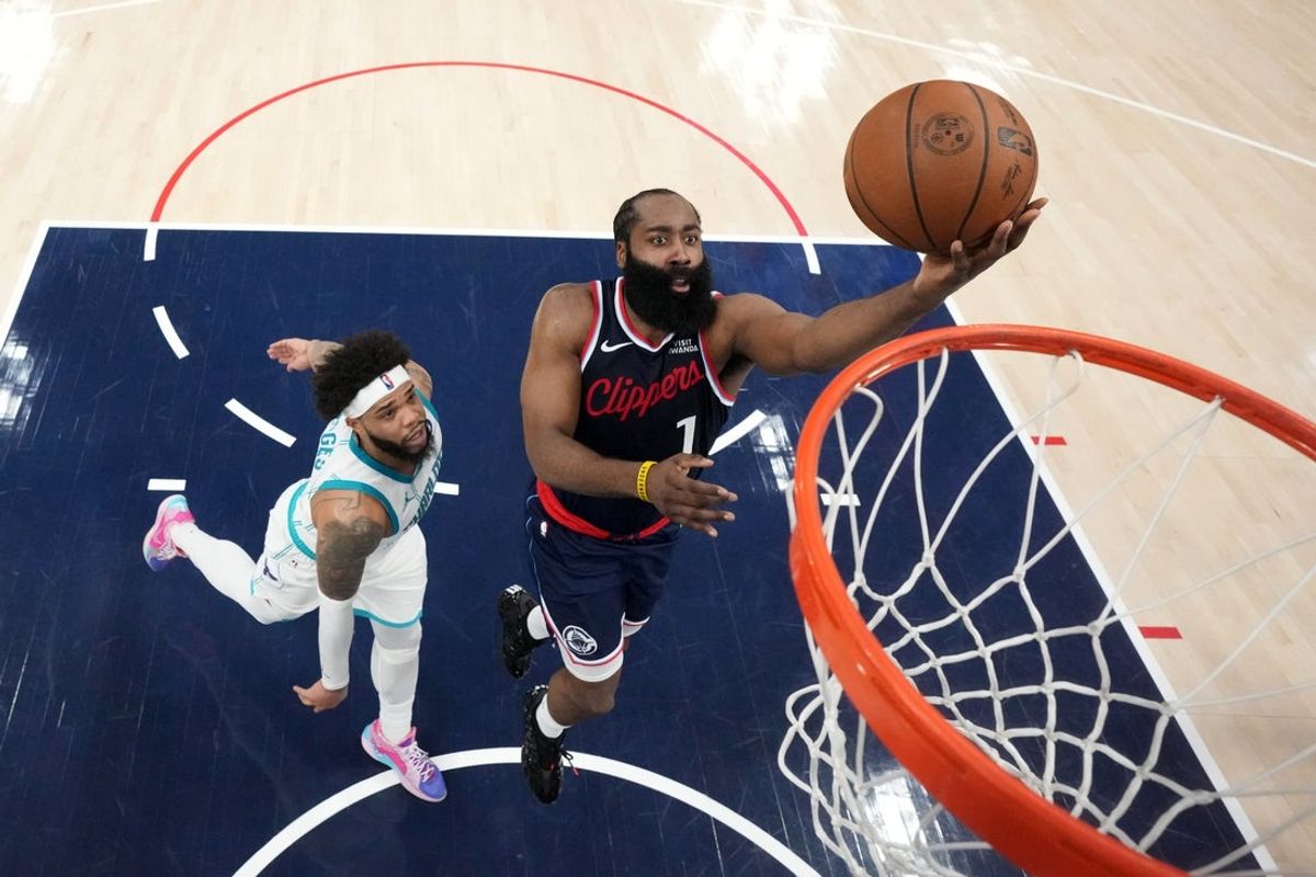 Jan 12, 2026; Inglewood, California, USA; LA Clippers guard James Harden (1) shoots the ball against Charlotte Hornets forward Miles Bridges (0) in the first half at Intuit Dome. Mandatory Credit: Kirby Lee-Imagn Images
