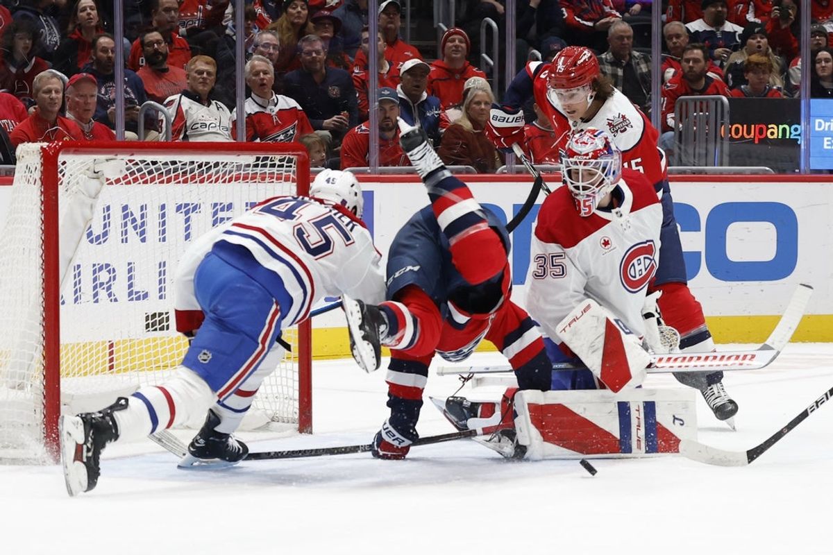 Jan 13, 2026; Washington, District of Columbia, USA; Washington Capitals left wing Anthony Beauvillier (72) is tripped by Montréal Canadiens defenseman Alexandre Carrier (45) while attempting a shot on Canadiens goaltender Samuel Montembeault (35) during the first period at Capital One Arena. Mandatory Credit: Geoff Burke-Imagn Images