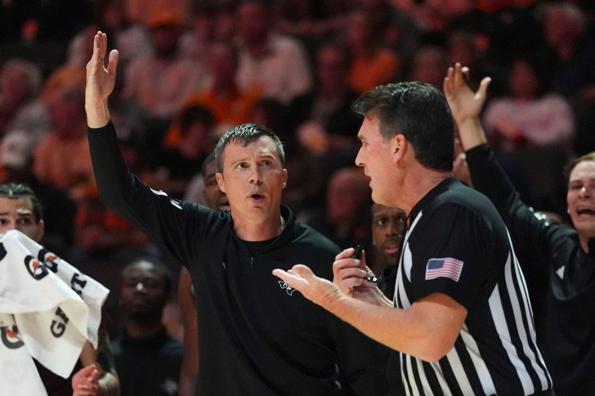 Texas A&M basketball coach Bucky McMillan looks at the referee asking to a foul to be called during a NCAA basketball game between Tennessee and Texas A&M at Thompson-Boling Arena at Food City Center in Knoxville, Tenn., on Jan. 13, 2026.