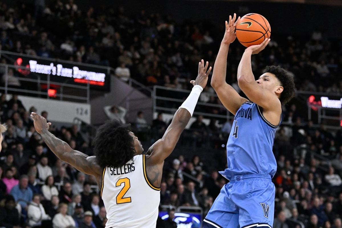 Jan 13, 2026; Providence, Rhode Island, USA; Villanova Wildcats guard Tyler Perkins (4) shoots over Providence Friars guard Jaylin Sellers (2) during the second half at Amica Mutual Pavilion. Mandatory Credit: Eric Canha-Imagn Images
