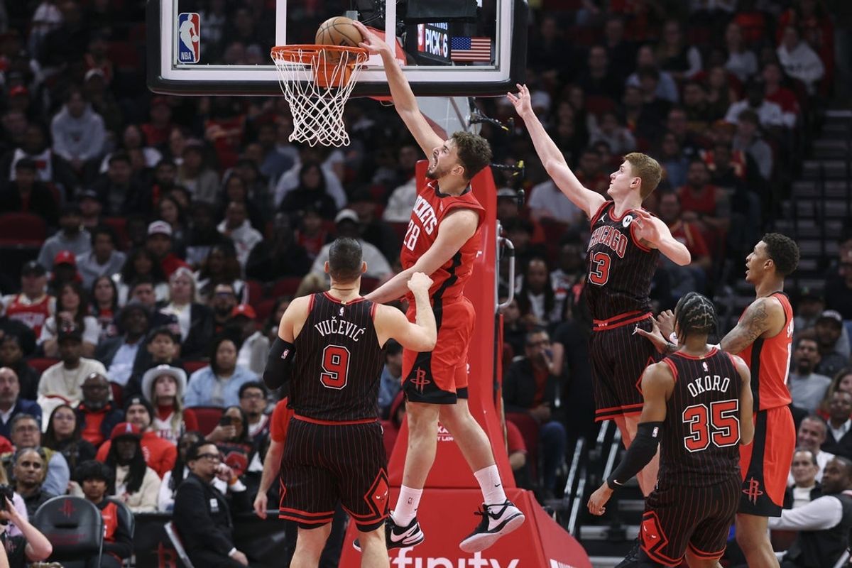 Jan 13, 2026; Houston, Texas, USA; Houston Rockets center Alperen Sengun (28) dunks the ball during the second quarter against the Chicago Bulls at Toyota Center. Mandatory Credit: Troy Taormina-Imagn Images