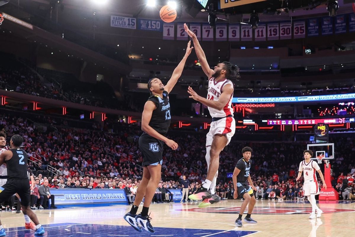 Jan 13, 2026; New York, New York, USA;  St. John's Red Storm forward Zuby Ejiofor (24) shoots past Marquette Golden Eagles forward Royce Parham (13) in the second half at Madison Square Garden Mandatory Credit: Wendell Cruz-Imagn Images
