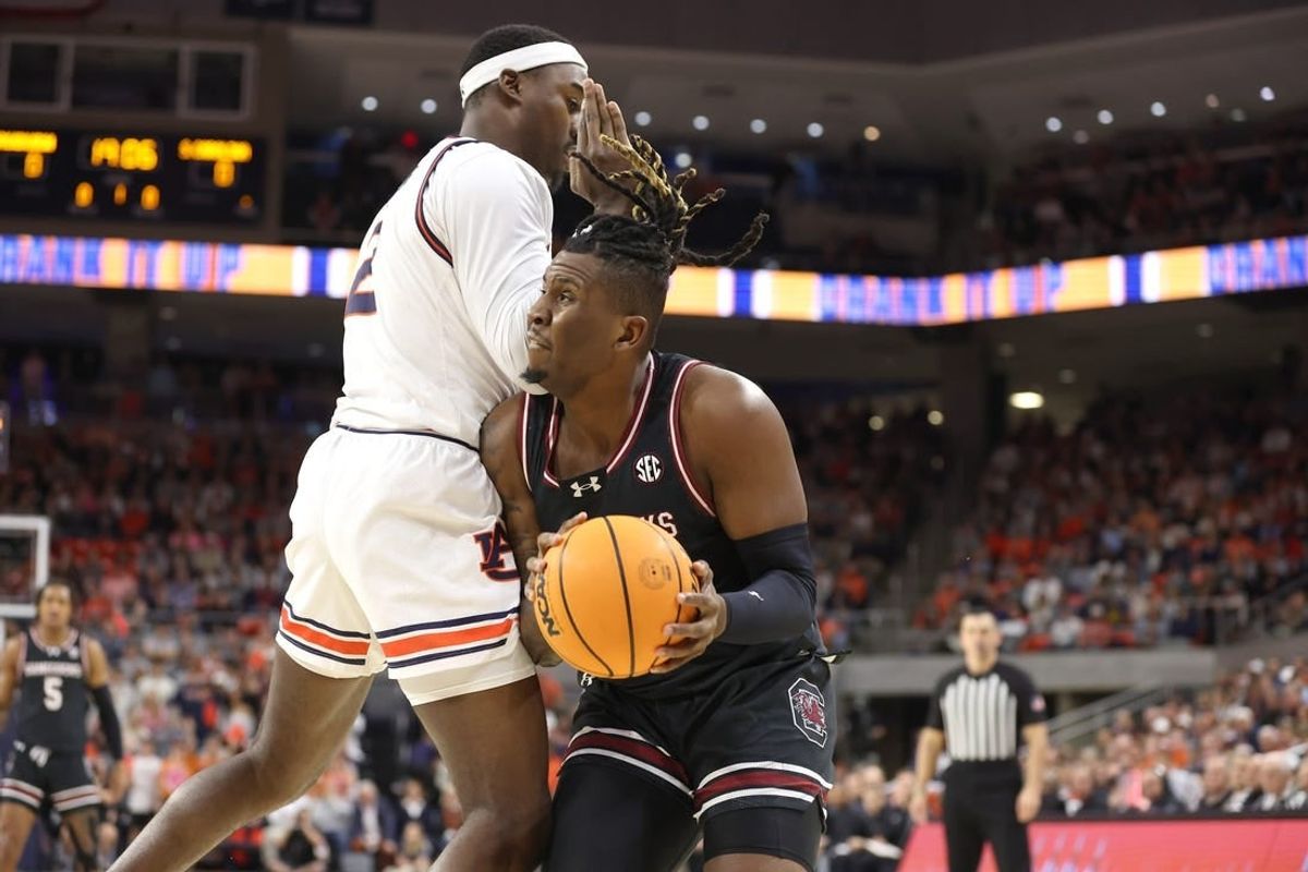 Feb 14, 2024; Auburn, Alabama, USA; South Carolina Gamecocks forward B.J. Mack (2) is fouled by Auburn Tigers forward Jaylin Williams (2) during the first half at Neville Arena.
