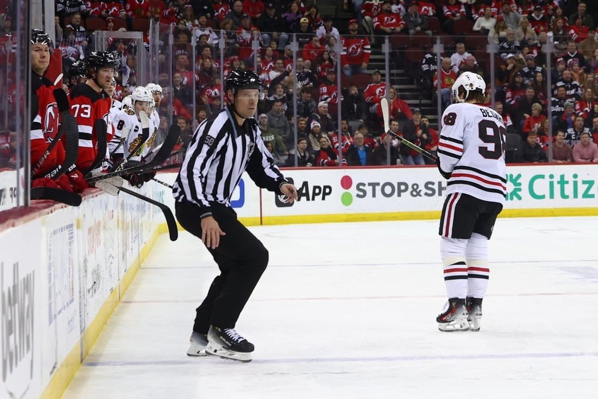 Jan 5, 2024; Newark, New Jersey, USA; Chicago Blackhawks center Connor Bedard (98) leaves the ice after being hit by New Jersey Devils defenseman Brendan Smith (2) (not shown) during the first period at Prudential Center.