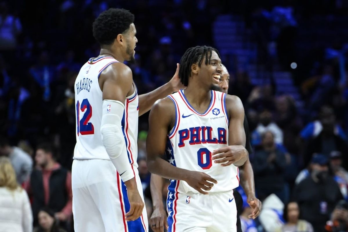 Nov 12, 2023; Philadelphia, Pennsylvania, USA; Philadelphia 76ers guard Tyrese Maxey (0) is greeted by Philadelphia 76ers forward Tobias Harris (12) after a 50 point performance against the Indiana Pacers at Wells Fargo Center.