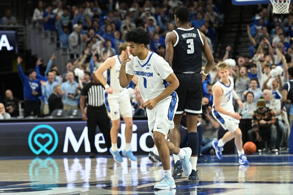 Jan 13, 2026; Omaha, Nebraska, USA;  Creighton Bluejays guard Austin Swartz (1) reacts after a three point basket against the Georgetown Hoyas during the first half at CHI Health Center Omaha. Mandatory Credit: Steven Branscombe-Imagn Images