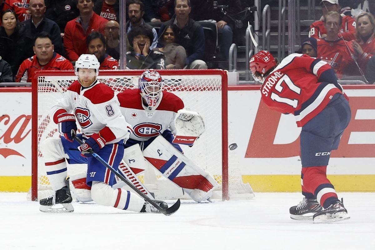 Jan 13, 2026; Washington, District of Columbia, USA; Washington Capitals center Dylan Strome (17) shoots the puck on Montréal Canadiens goaltender Samuel Montembeault (35) during overtime at Capital One Arena. Mandatory Credit: Geoff Burke-Imagn Images