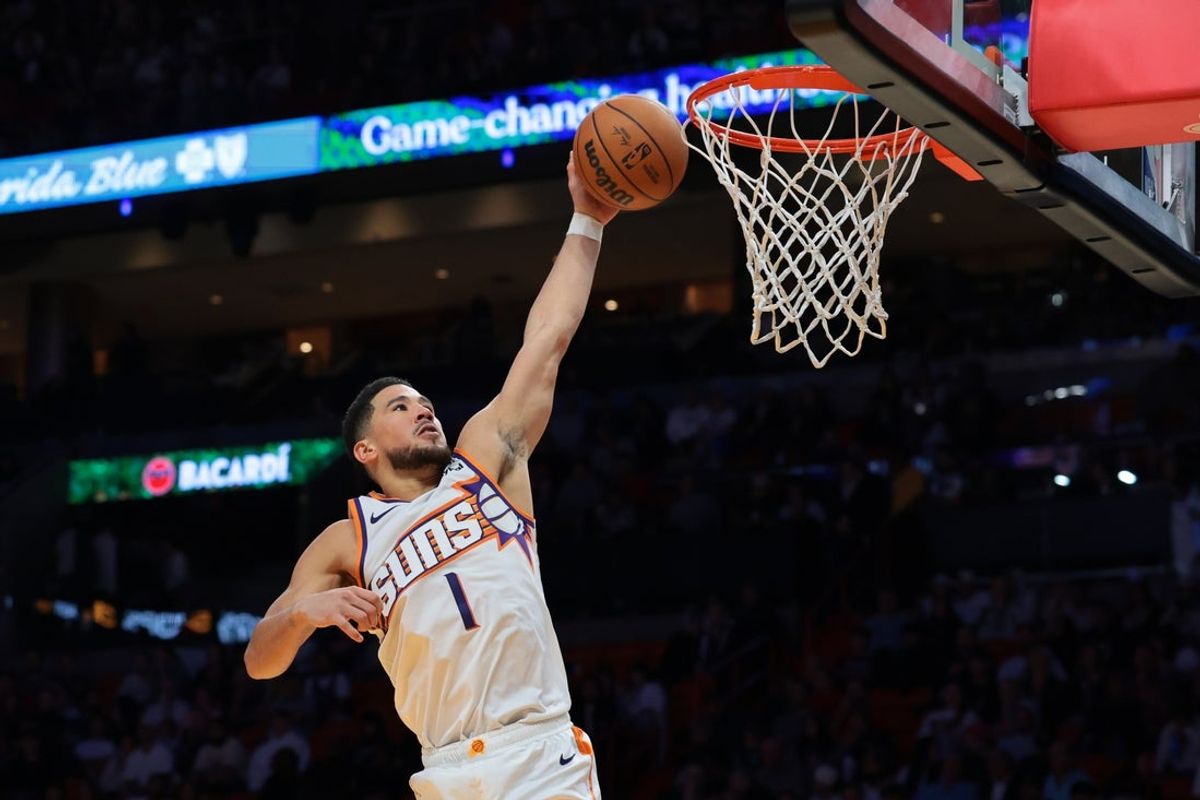 Jan 13, 2026; Miami, Florida, USA; Phoenix Suns guard Devin Booker (1) dunks against the Miami Heat during the third quarter at Kaseya Center. Mandatory Credit: Sam Navarro-Imagn Images