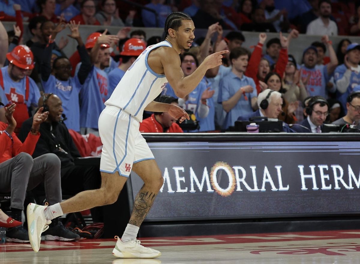 Jan 13, 2026; Houston, Texas, USA; Houston Cougars guard Milos Uzan (7) reacts to his three point basket against the West Virginia Mountaineers  in the first half at Fertitta Center. Mandatory Credit: Thomas Shea-Imagn Images