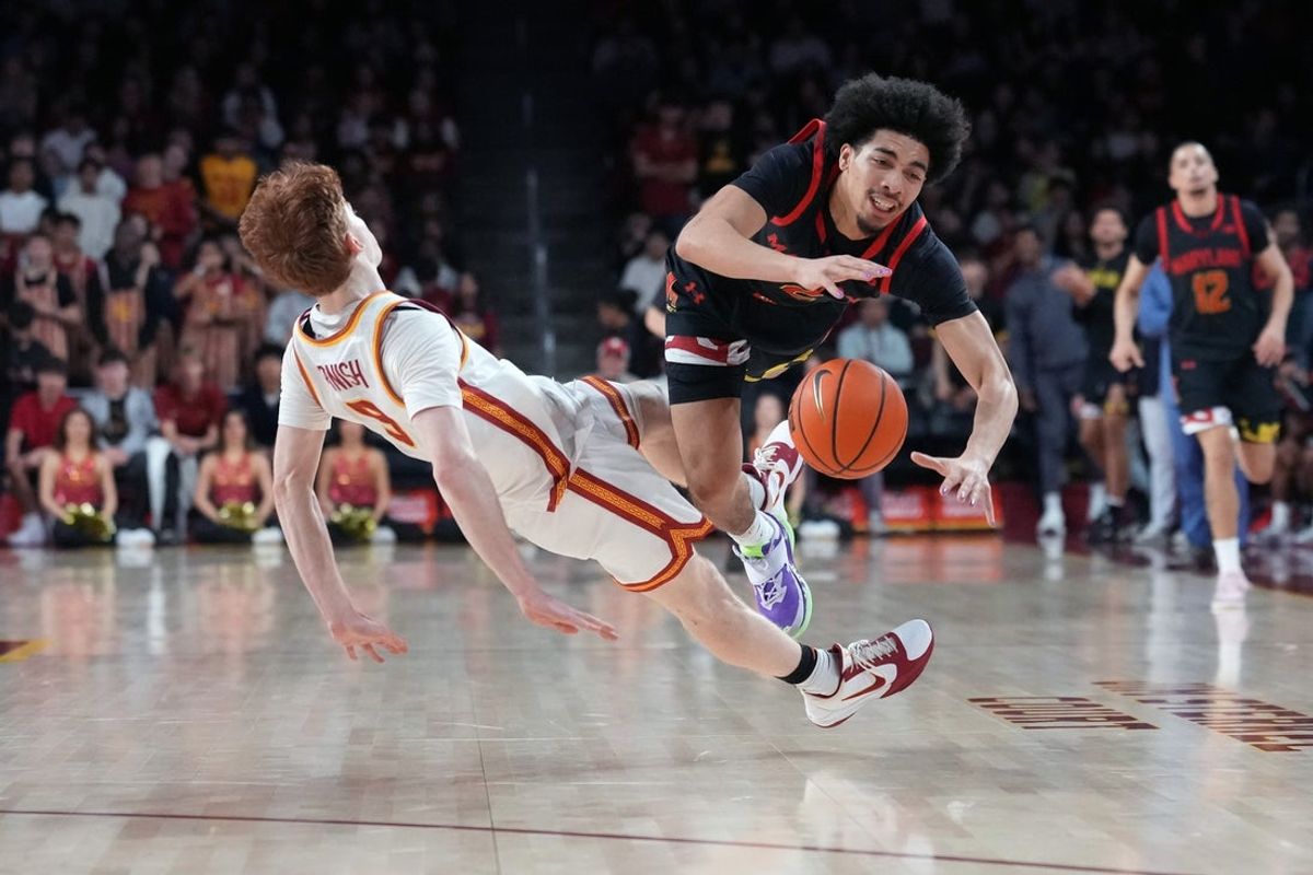 Jan 13, 2026; Los Angeles, California, USA; Maryland Terrapins guard Myles Rice (2) collides with Southern California Trojans guard Ryan Cornish (9) in the first half at Galen Center. Mandatory Credit: Kirby Lee-Imagn Images