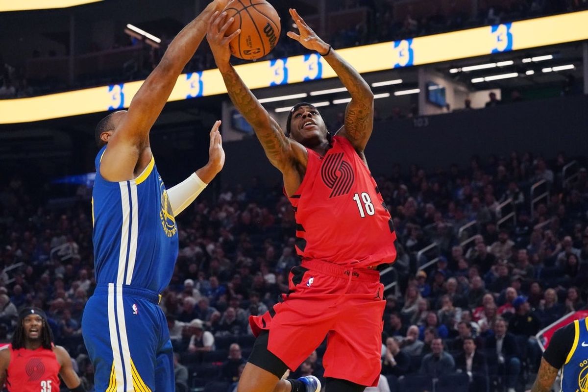 Jan 13, 2026; San Francisco, California, USA;  Portland Trail Blazers guard Javonte Cooke (18) and Golden State Warriors center/forward Al Horford (20) battle for a rebound in the first quarter at Chase Center. Mandatory Credit: David Gonzales-Imagn Images