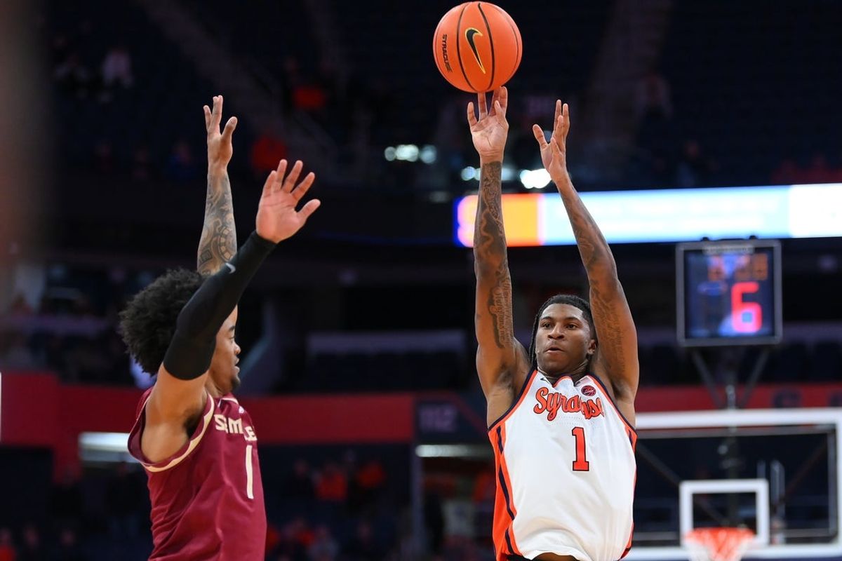 Jan 13, 2026; Syracuse, New York, USA; Syracuse Orange forward Donnie Freeman (1) shoots against Florida State Seminoles guard Martin Somerville (1) during the second half at the JMA Wireless Dome. Mandatory Credit: Rich Barnes-Imagn Images