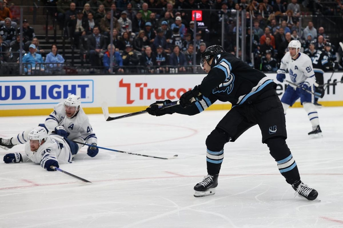 Jan 13, 2026; Salt Lake City, Utah, USA; Utah Mammoth right wing Dylan Guenther (11) scores against the Toronto Maple Leafs during the second period at Delta Center. Mandatory Credit: Rob Gray-Imagn Images