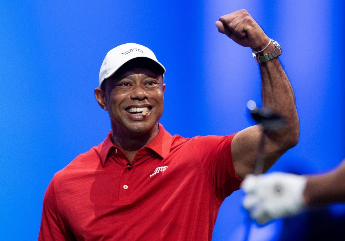Tiger Woods of Jupiter Links cheers on a teammate during a TGL match against New York Golf Club at SoFi Center on January 13, 2026, in Palm Beach Gardens, Florida.