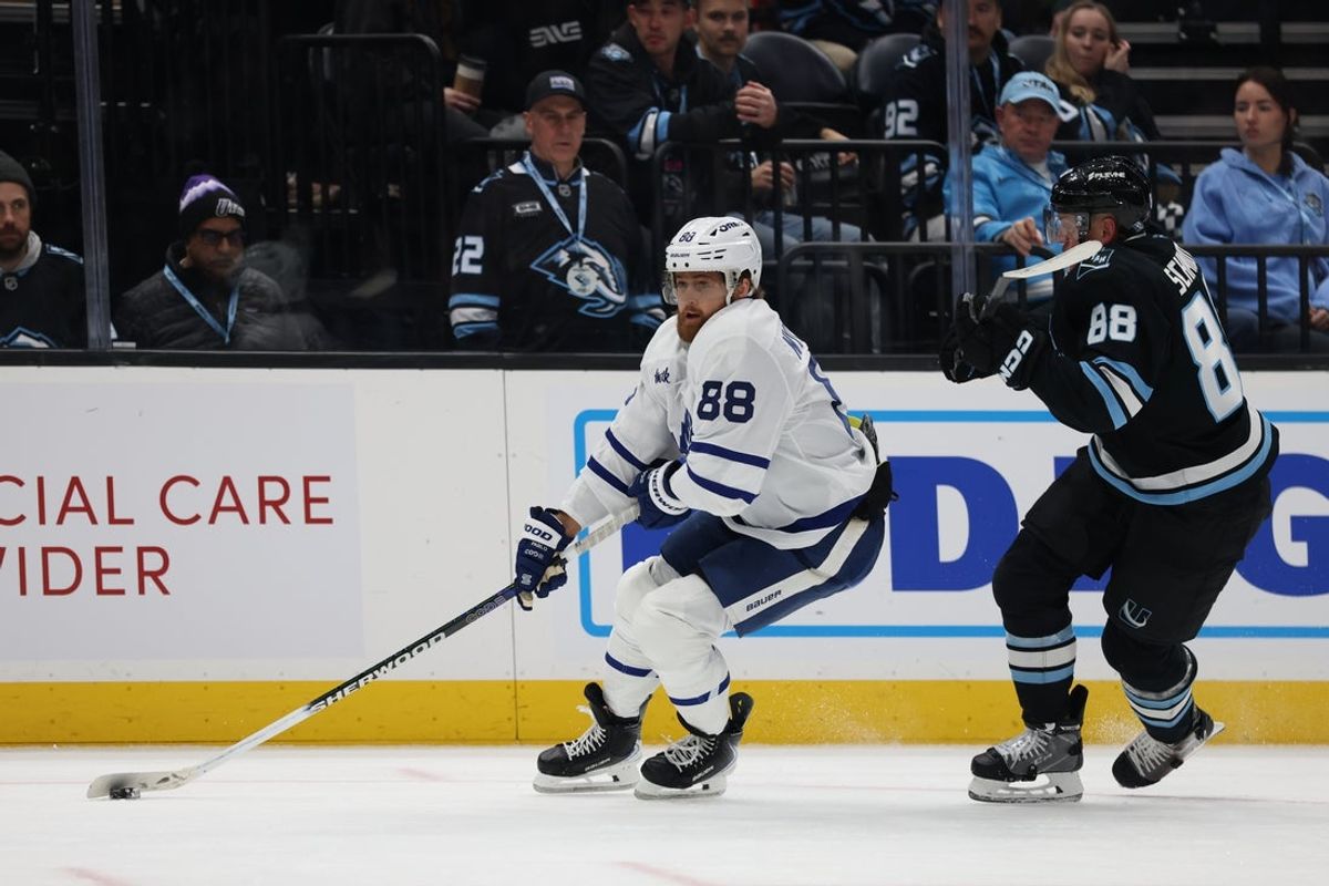 Jan 13, 2026; Salt Lake City, Utah, USA; Toronto Maple Leafs right wing William Nylander (88) skates with the puck against Utah Mammoth defenseman Nate Schmidt (88) during the third period at Delta Center. Mandatory Credit: Rob Gray-Imagn Images