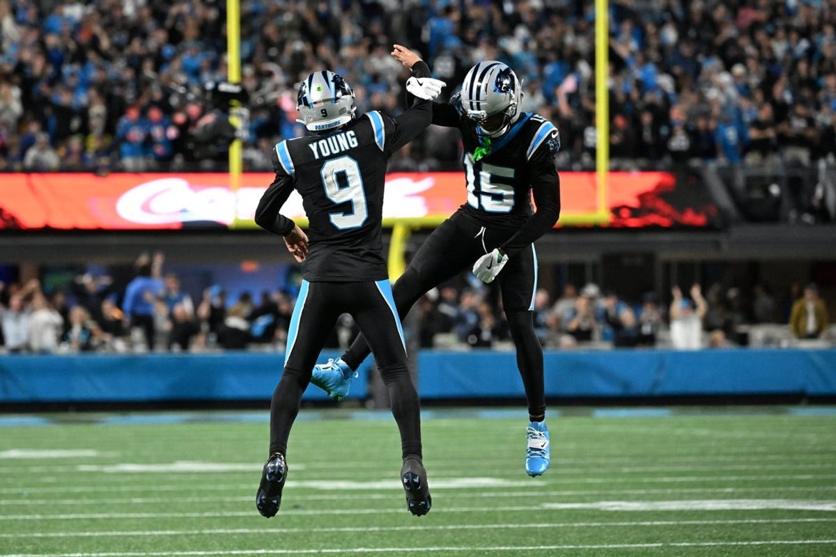 Jan 10, 2026; Charlotte, NC, USA; Carolina Panthers quarterback Bryce Young (9) and wide receiver Jimmy Horn Jr. (15) reacts in the fourth quarter in an NFC Wild Card Round game at Bank of America Stadium. Mandatory Credit: Bob Donnan-Imagn Images