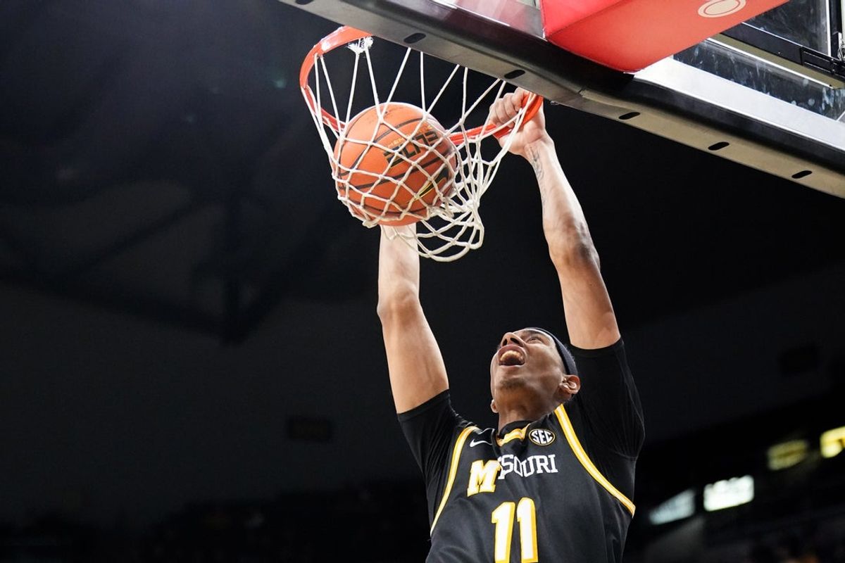Jan 14, 2026; Columbia, Missouri, USA; Missouri Tigers guard Trent Pierce (11) dunks the ball against the Auburn Tigers during the first half of the game at Mizzou Arena. Mandatory Credit: Denny Medley-Imagn Images