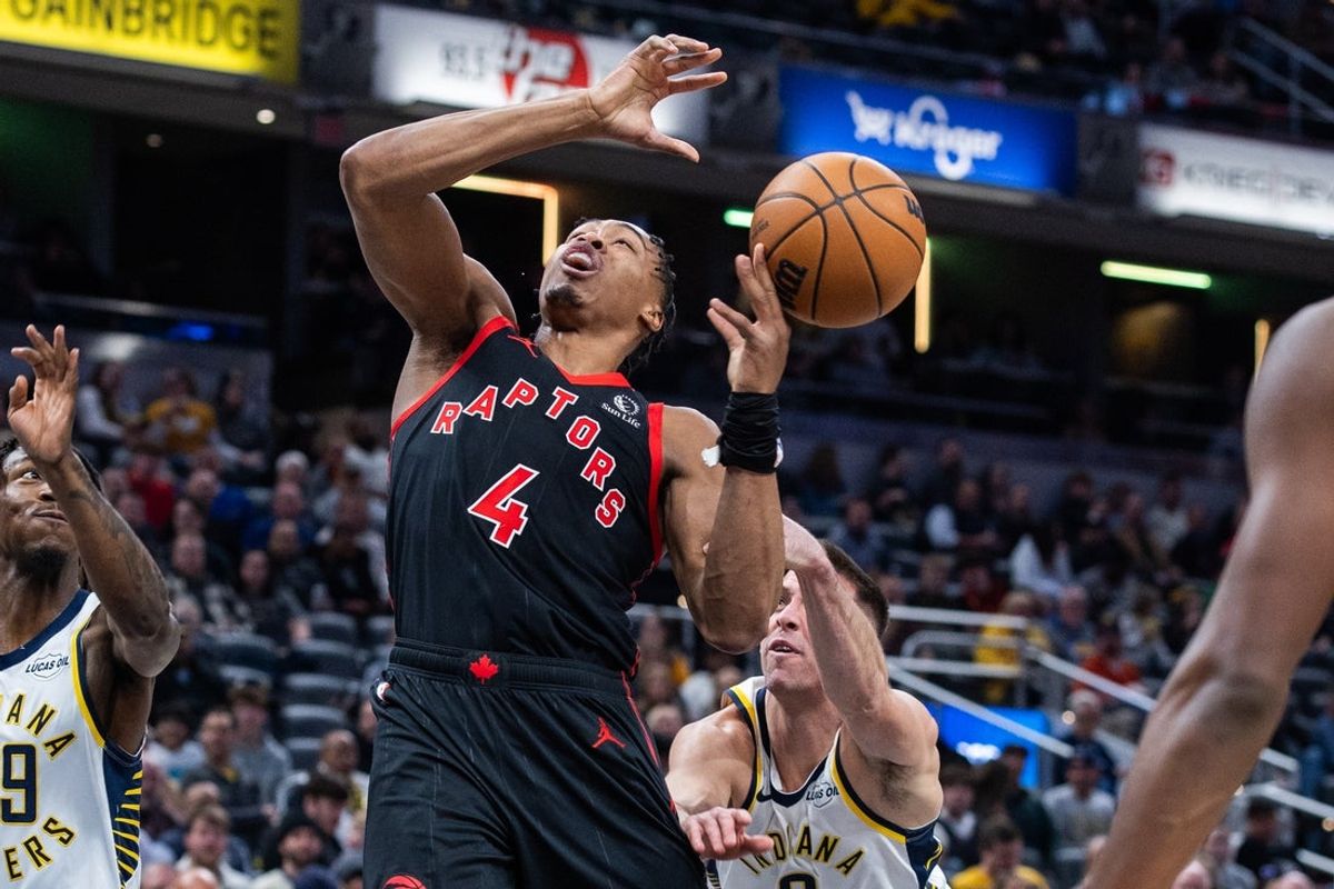 Jan 14, 2026; Indianapolis, Indiana, USA; Toronto Raptors forward/guard Scottie Barnes (4) shoots the ball while Indiana Pacers guard T.J. McConnell (9)  defends in the first half at Gainbridge Fieldhouse. Mandatory Credit: Trevor Ruszkowski-Imagn Images