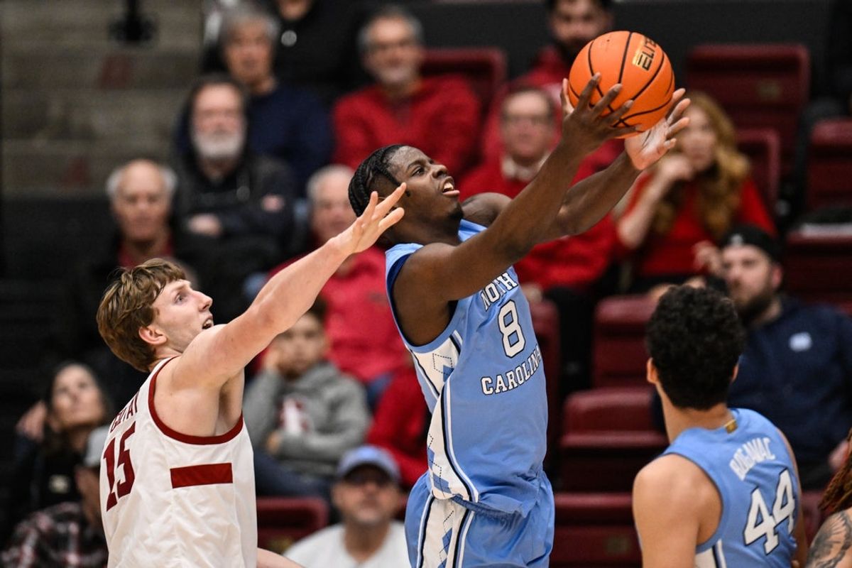 Jan 14, 2026; Stanford, California, USA; North Carolina Tar Heels forward Caleb Wilson (8) shoots against Stanford Cardinal forward Oskar Giltay (15) in the first half at Maples Pavilion. Mandatory Credit: Eakin Howard-Imagn Images