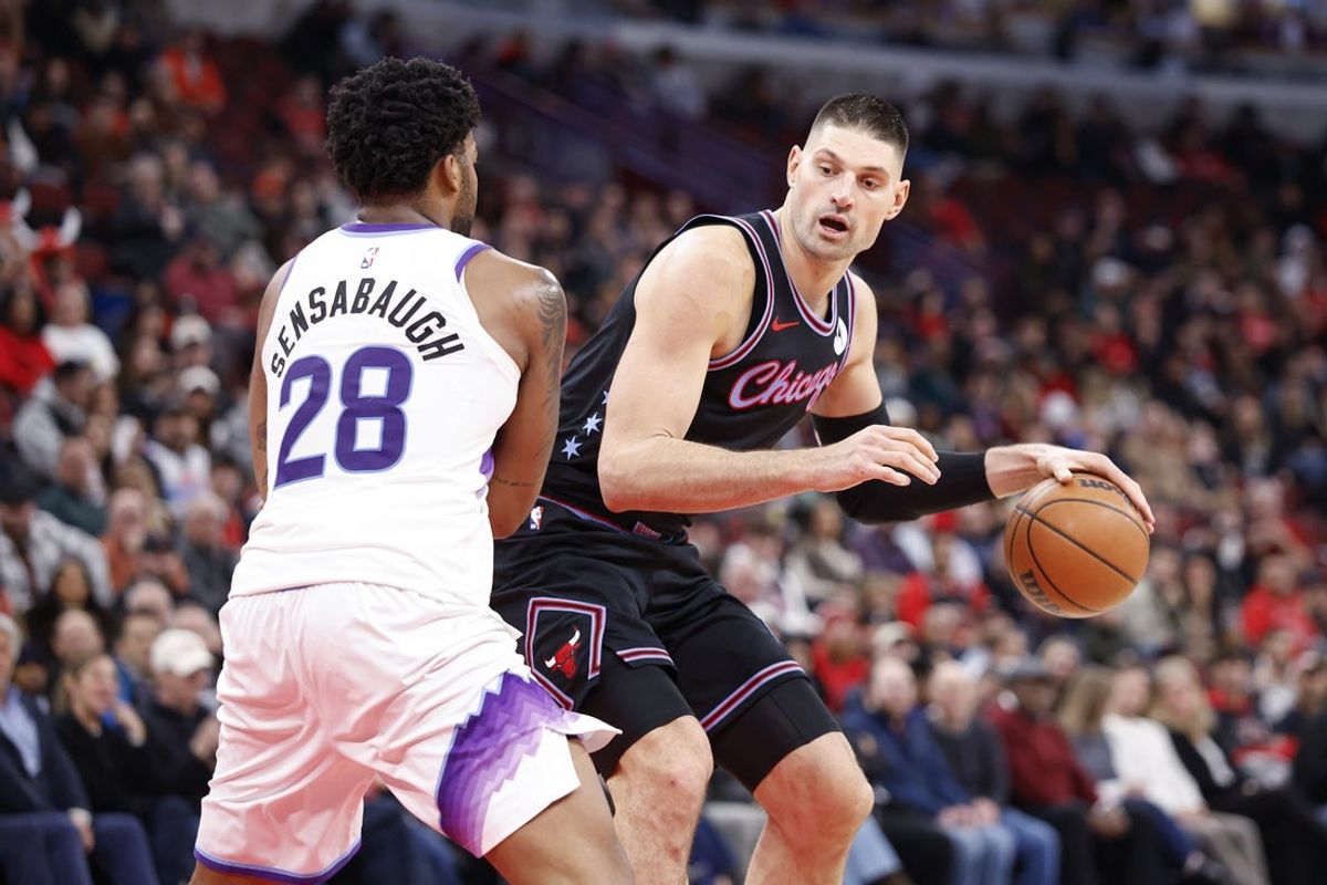 Jan 14, 2026; Chicago, Illinois, USA; Utah Jazz forward Brice Sensabaugh (28) defends against Chicago Bulls center Nikola Vucevic (9) during the second half at United Center. Mandatory Credit: Kamil Krzaczynski-Imagn Images