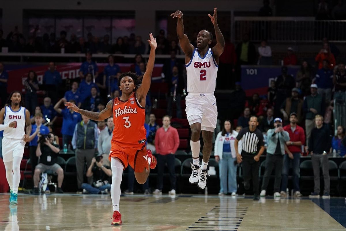 Jan 14, 2026; Dallas, Texas, USA;  SMU Mustangs guard Boopie Miller (2) follows through on a game winning half court shot as Virginia Tech Hokies guard Ben Hammond (3) defends during the second half at Moody Coliseum. Mandatory Credit: Raymond Carlin III-Imagn Images