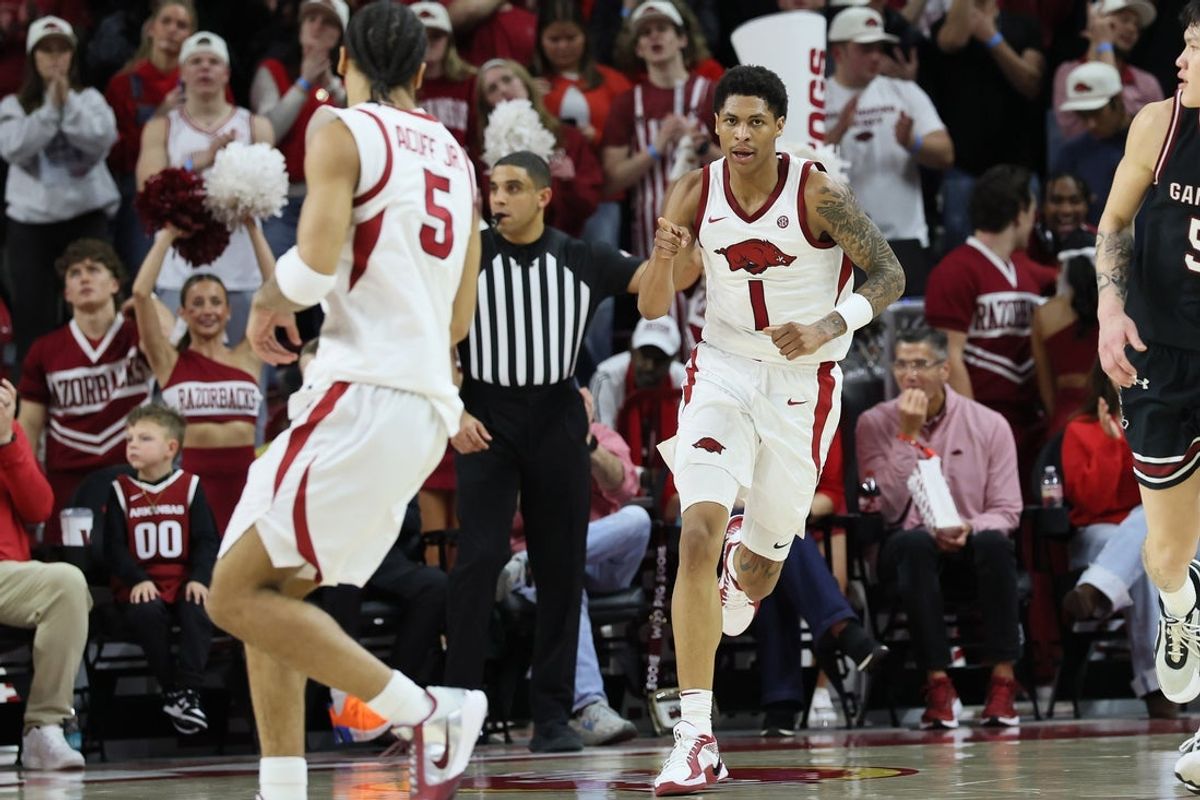 Jan 14, 2026; Fayetteville, Arkansas, USA; Arkansas Razorbacks guards Darius Acuff Jr (5) and Meleek Thomas (1) celebrate after a play during the second half against the South Carolina Gamecocks at Bud Walton Arena. Arkansas won 108-74. Mandatory Credit: Nelson Chenault-Imagn Images