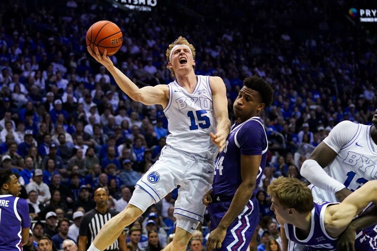 Jan 14, 2026; Provo, Utah, USA; BYU Cougars guard Richie Saunders (15) drives to the basket against the TCU Horned Frogs during the first half  at Marriott Center. Mandatory Credit: Aaron Baker-Imagn Images