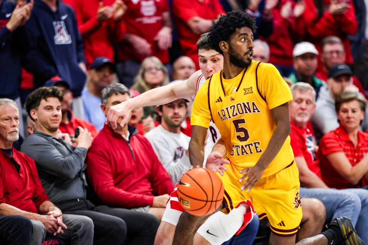 Jan 14, 2026; Tucson, Arizona, USA; Arizona Wildcats forward Ivan Kharchenkov (8) attempts to steal the ball from Arizona State Sun Devils guard Moe Odum (5) during the second half of the game at McKale Memorial Center. Mandatory Credit: Aryanna Frank-Imagn Images